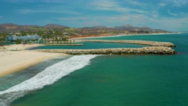 SAN JOSE DEL CABO MEXICO-2020: Stones Arranged Inside The Green And Blue Sea
