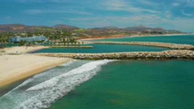SAN JOSE DEL CABO MEXICO-2020: White Stones On A Green Blue Sea Water