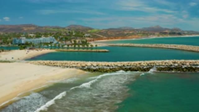 SAN JOSE DEL CABO MEXICO-2020: Stones Arranged In The Green And Blue Sea Water