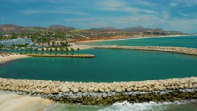SAN JOSE DEL CABO MEXICO-2020: Blue Water Beach With Many Trees Surrounding
