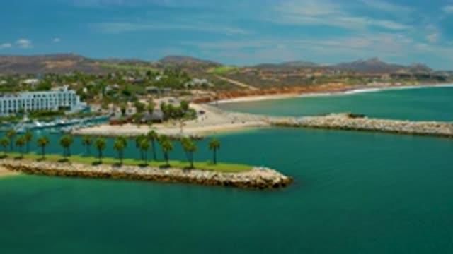 SAN JOSE DEL CABO MEXICO-2020: A White Building At The Seaside In Front Of A Lagoon