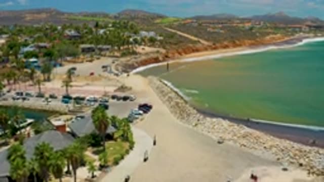 SAN JOSE DEL CABO MEXICO-2020: Green And Blue Sea Water Lot Of Tall Buildings