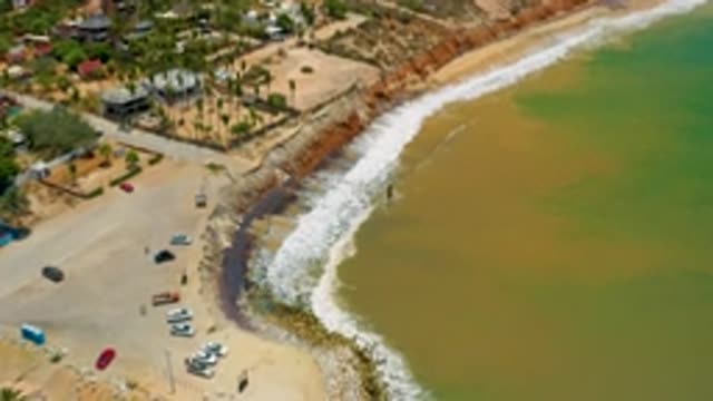 SAN JOSE DEL CABO MEXICO-2020: Beach Ocean Crashing Waves Cars Parked Summer