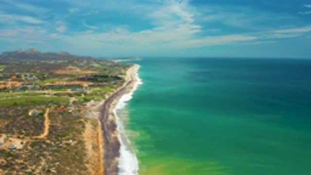 SAN JOSE DEL CABO MEXICO-2020: Bright Seaside View Of A Coastal Destination With Waves Crashing On Sand