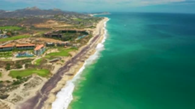 SAN JOSE DEL CABO MEXICO-2020: Expansive Open Blue Sea Washes Upon Sandy Shore
