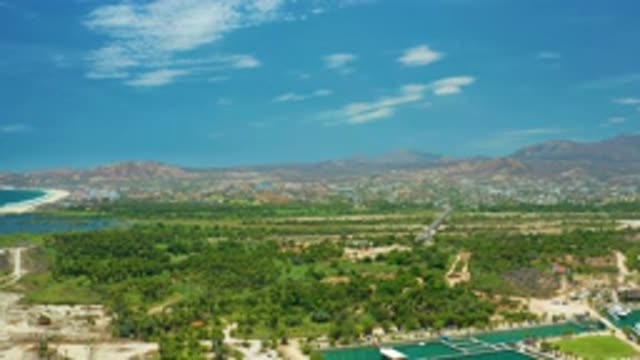 SAN JOSE DEL CABO MEXICO-2020: On Hot Day Lovely Clouds Greenish Plants Blue