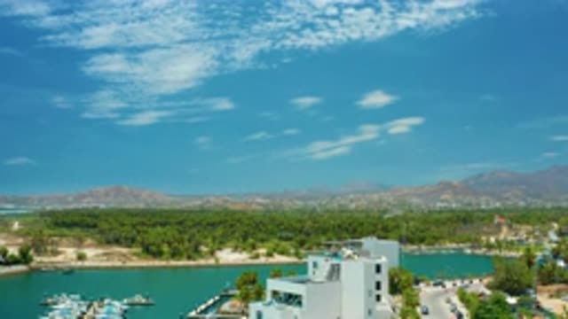 SAN JOSE DEL CABO MEXICO-2020: Tall White Buildings and Ships in the Blue Sea