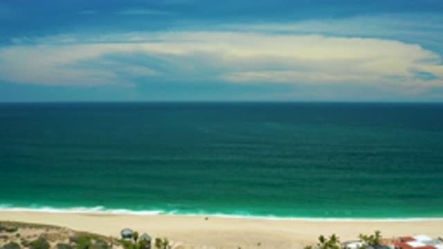 SAN JOSE DEL CABO MEXICO-2020: Beach Green Ocean Tide Calm Water And Wide