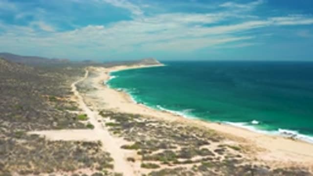 SAN JOSE DEL CABO MEXICO-2020: Rocky Coastline With Mountains In The Distance