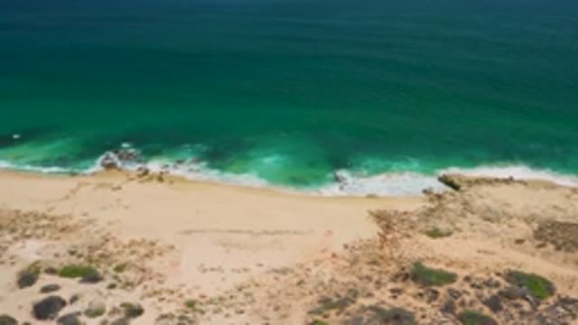 SAN JOSE DEL CABO MEXICO-2020: Tide Coming In As Green Ocean Waves Roll In On