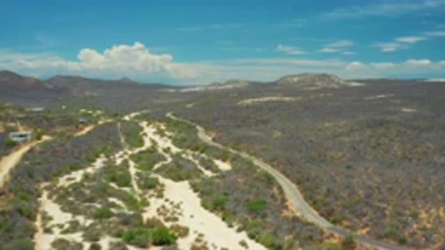 SAN JOSE DEL CABO MEXICO-2020: Large Mountain Range Desert Roads Cacti Like