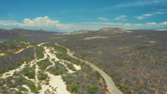 SAN JOSE DEL CABO MEXICO-2020: Aerial Footage Of A Winding Road Cutting Through