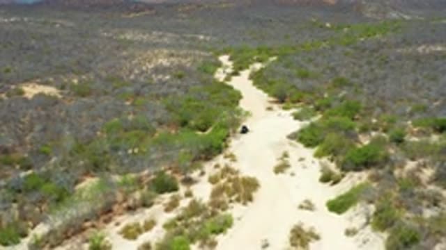 SAN JOSE DEL CABO MEXICO-2020: Drone Footage Over Dirt Road In Desert
