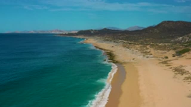 LAGUNA BEACH BCS MEXICO-2020: A Beach Shore With Small Mountains And Trees As