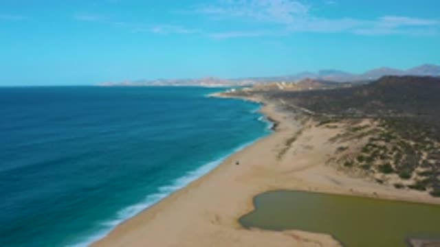 LAGUNA BEACH BCS MEXICO-2020: Large Open Blue Sea Meets Sandy Shore With Plants
