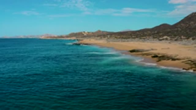 LAGUNA BEACH BCS MEXICO-2020: Drone Video Panning Beach Tide Mountains Surf