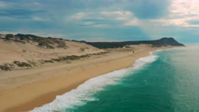 LAGUNA BEACH BCS MEXICO-2020: Clear Sea Water With Mild Waves And White Foam
