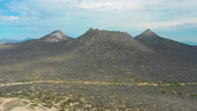LAGUNA BEACH BCS MEXICO-2020: Muddy Long Road With White Clouds and Blue Sky Tall Mountains