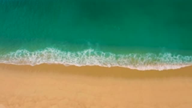 LAGUNA BEACH BCS MEXICO-2020: Clear Blue Waves Wash Against Sandy Beach Creating