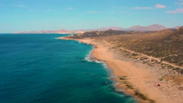 LAGUNA BEACH BCS MEXICO-2020: Slowly Panning Drone Footage of Beach Tide Surf Ocean