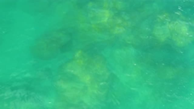 LAGUNA BEACH BCS MEXICO-2020: Rocks Are Visible Under The Running Water Of A Sea