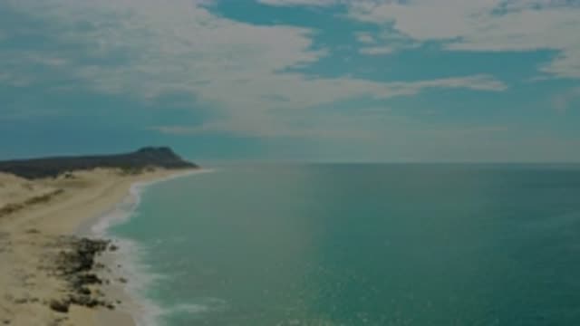 LAGUNA BEACH BCS MEXICO-2020: Rocky Shore Meets White-Capped Blue Sea and Cloudy Sky