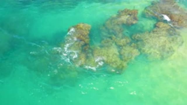 LAGUNA BEACH BCS MEXICO-2020: Rough Rocks Submerged Beneath Blue Ocean Waves And