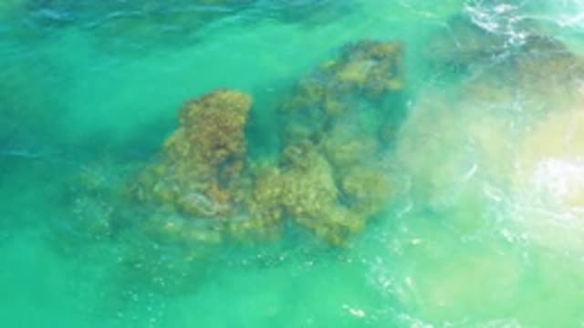 LAGUNA BEACH BCS MEXICO-2020: Clear Blue Water Passes Over Textured Rock