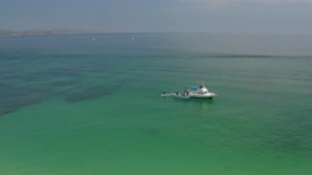 PALMILLA BEACH BCS MEXICO-2020: White Ship And Small Boat In The Center Of The