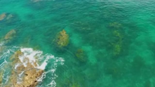 PALMILLA BEACH BCS MEXICO-2020: Panning Over Rough Rocks Submerged In Blue Sea