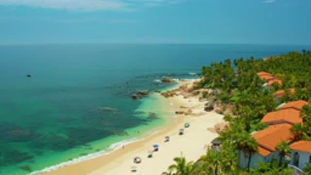 PALMILLA BEACH BCS MEXICO-2020: Landscape Of Houses Among Trees On Coastline
