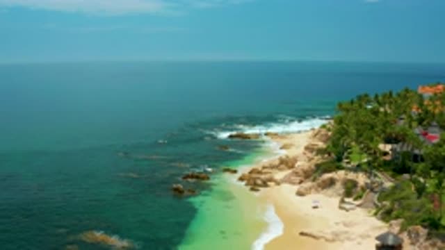 PALMILLA BEACH BCS MEXICO-2020: Ocean Waves Crashing On Sandy Shore With Cliff