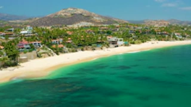 PALMILLA BEACH BCS MEXICO-2020: Houses And Buildings With Red Tile Roofs Sit In