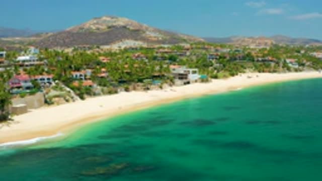 PALMILLA BEACH BCS MEXICO-2020: Green And Blue Sea Water With Lot Of Buildings