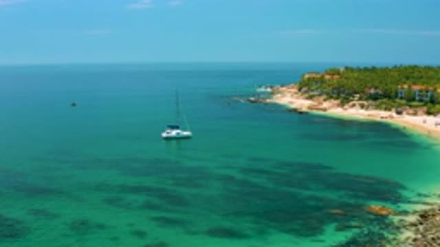 PALMILLA BEACH BCS MEXICO-2020: Yacht On The Coast Side With Cliffs In