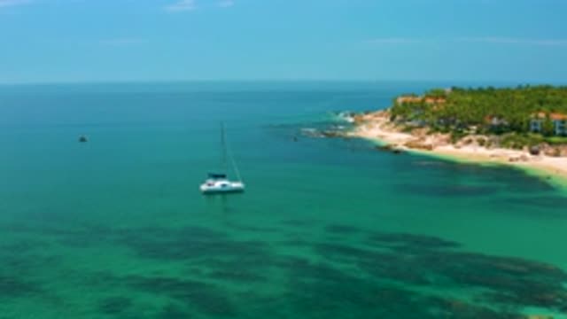 PALMILLA BEACH BCS MEXICO-2020: Boat Floats Upon Clear Blue Water Amid Coast