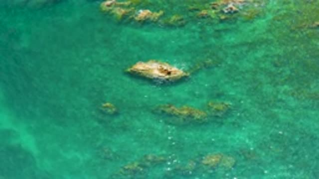 PALMILLA BEACH BCS MEXICO-2020: Aerial View Of Green Water Body With Rocks