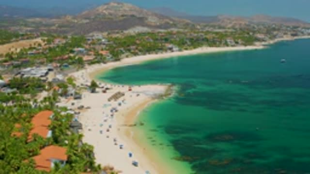 PALMILLA BEACH BCS MEXICO-2020: Large Umbrellas Line A Sandy Beach With