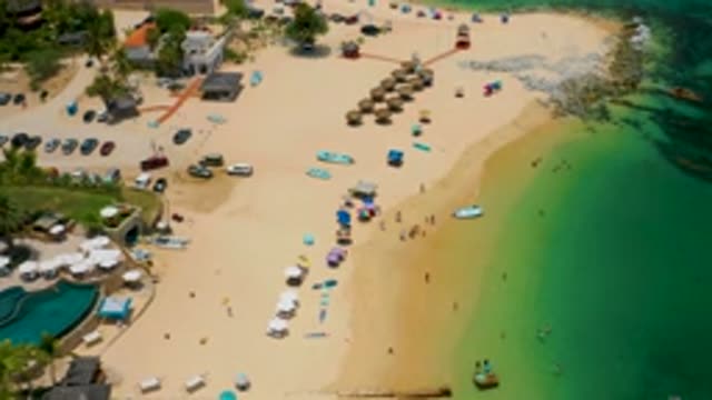 PALMILLA BEACH BCS MEXICO-2020: Tourists Walk On A Beach Toward Beach Umbrellas