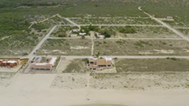 LA RIBERA BCS MEXICO-2020: Green Grass Field with House and Blue Sky