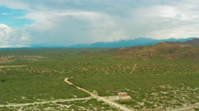 LA RIBERA BCS MEXICO-2020: Mountains And Flat Landscape With A Building And
