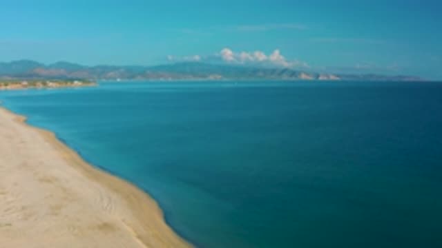 LA RIBERA BCS MEXICO-2020: Panning Over Sandy Beach Towards Open Blue Sea And