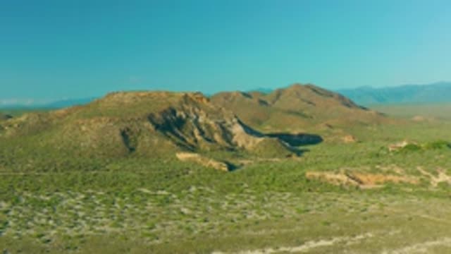 LA RIBERA BCS MEXICO-2020: Mountains Surrounded By Tree Covered Ground And Open