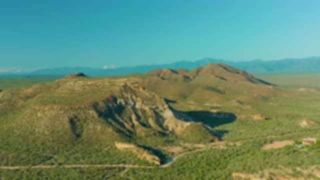 LA RIBERA BCS MEXICO-2020: Green Field With Mountains Under Blue Sky