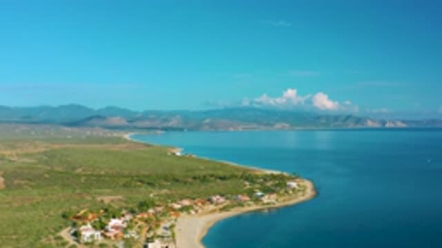 LA RIBERA BCS MEXICO-2020: Aerial View Of A Curving Sandy Shoreline With Houses