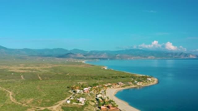 LA RIBERA BCS MEXICO-2020: A Dirt Road Leads To A Cluster Of Buildings On A