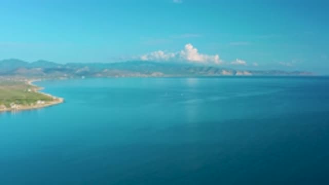 LA RIBERA BCS MEXICO-2020: White Clouds Squat Over A Mountain Range On A