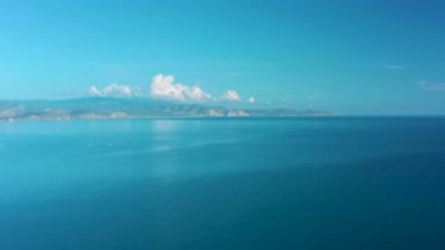 LA RIBERA BCS MEXICO-2020: Fluffy White Clouds Hanging Over An Island In The