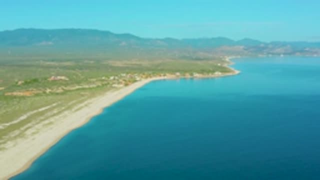 LA RIBERA BCS MEXICO-2020: A Clear Blue Sky Sits Over A Mountain Range That