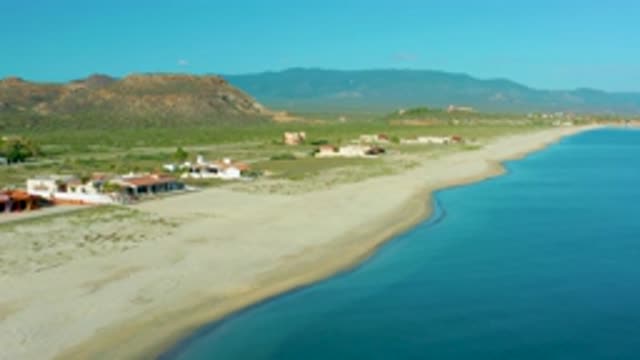 LA RIBERA BCS MEXICO-2020: Tall Building Near Sea Shore With Sand Long Beach